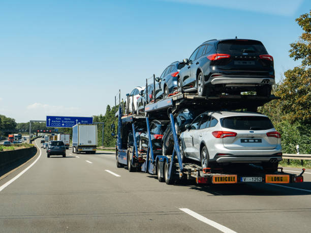 Germany - Aug 22, 2019: Trucks carrying multiple Ford Focus cars on the platform delivery cargo